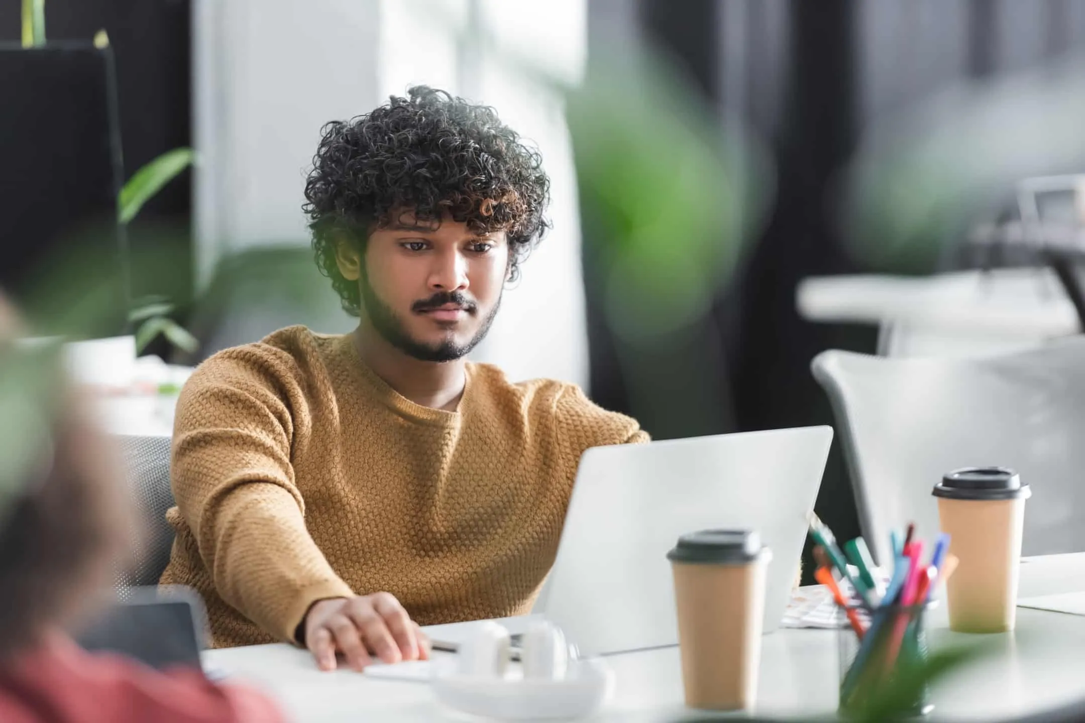 business person browsing whatsapp business live chat customer service tools and features on laptop