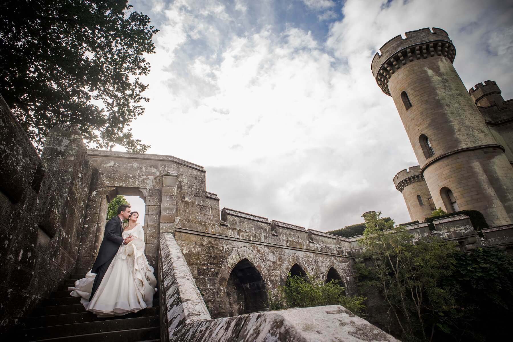 Couple having photos taken on the outdoor staircase